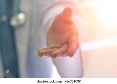 Philanthropy Helping Hand Doctor Medical Healthcare Specialized Assistance Concept. Hand Of Physician In Hospital Offering Support Service For Patient. 