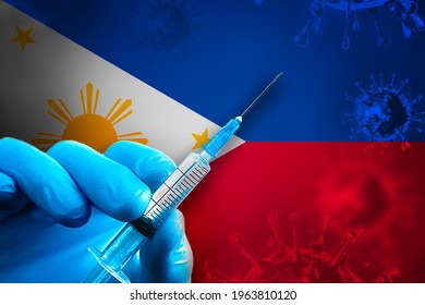 Philippines Covid-19 Vaccination Campaign. A Hand In A Blue Rubber Glove Holds A Syringe With Covid-19 Virus Vaccine In Front Of Philippines Flag. Coronavirus Vaccination Concept