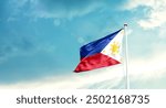 Philippines national flag fluttering. The flag blowing in beautiful soft sky. Philippines national flag for independence day.