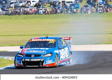 PHILLIP ISLAND, MELBOURNE/AUSTRALIA - 17 APRIL 2016: Nick Percat's Holden Commodore Suffers Mechanical Damage As It Exits Turn 4 At Phillip Island.