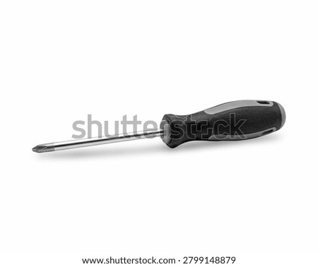 A Phillips head screwdriver with a red and black rubberized handle lying horizontally isolated on a clean white background.