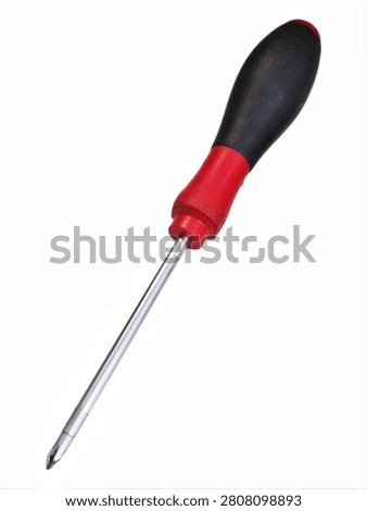 Phillips head screwdriver with red and black rubber grip handle isolated on white
