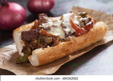 Philly cheese steak sandwich served on parchment paper
