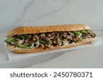 Philly cheesesteak on a marble background