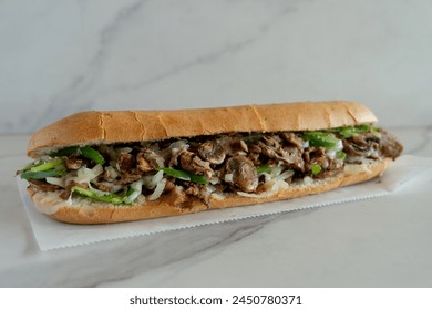 Philly cheesesteak on a marble background