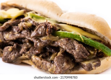 Philly Cheesesteak Sandwich With Beef, Cheese,green Pepers And Caramelized Onion Isolated On White Background