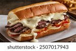 Philly Cheesesteak: A savory sandwich with thinly sliced steak, melted cheese, and sautéed onions and peppers, served in a hoagie roll.