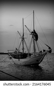 A Phinisi Boat Moored By The Sea