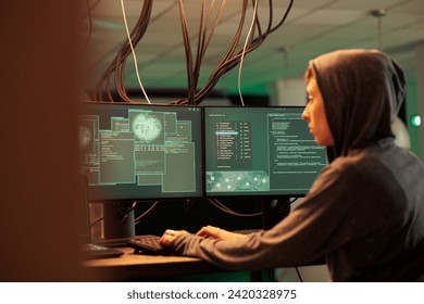 Phishing attack, computer network system hacking, hacker coding internet fraud program script, programming password cracking software on computer. Cyberattack, data breach, woman developing malware
