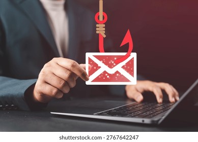 Phishing attack concept with man targeted by scam email on laptop, representing spoofing, fraudulent messages, cybersecurity risk, and online fraud awareness.