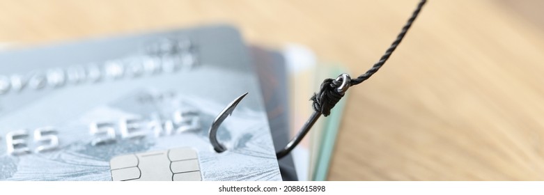 Phishing credit card scam using credit card in fishhook. Theft from bank cards