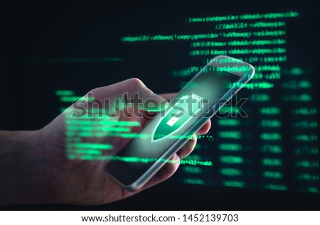 Phishing, cyber security, online information breach or identity theft crime concept. Hacked phone. Hacker and cellphone with hologram data. Mobile scam, fraud or crime. Cybersecurity infringement.