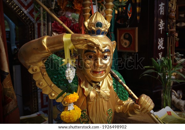 PHITSANULOK, THAILAND – FEBRUARY 27, 2021: A Chinese god statue or Monkey King or Sun Wukong standing at Vegetarian House of Sai Te Hok Taong in Muang district at Phitsanulok province of Thailand.