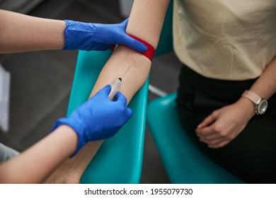 Phlebotomist Drawing Blood For A Laboratory Test