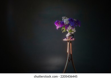 Phloxes In Vase On Vintage Wooden Shelf  On Dark Background