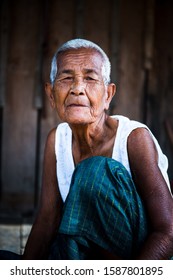 Phnom-pen, Island Koh Dach, Cambodia, 14.11.2013,  Elderly Lady With Silver Hair, Lives Alone And Is Cooking Her Lunch In-front Of Her Hut 