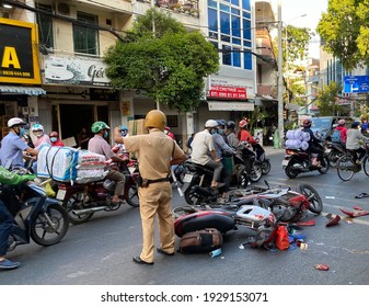 Pho Quang Street, Tan Binh District, Ho Chi Minh City, Vietnam - March 4, 2021: A traffic accident between two motorcycles, the police are handling the case in Ho Chi Minh City, Vietnam