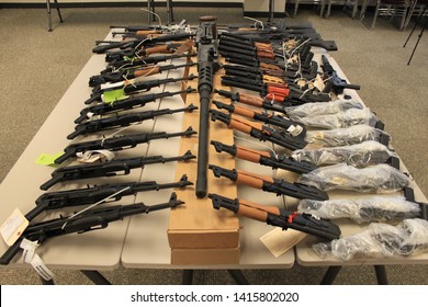 Phoenix, Ariz. / US - January 25, 2011: Guns, handguns, AK-47s and .50 caliber rifles, on display during an announcement about arrests and weapons seizures made during Operation Fast and Furious. 3986