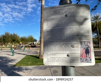 Phoenix, Ariz.  USA - January 20, 2021: Trump Supporters Upset About Election Results Leave Stickers Showing Guns And Promising Revolution On Signs Around The Capitol. 1977