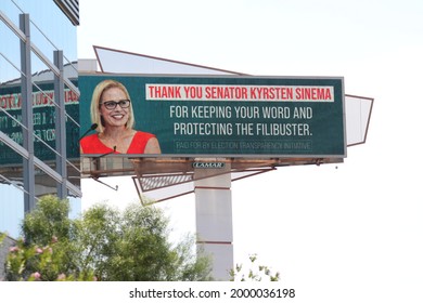 Phoenix, Ariz.  USA - June 29 2021: Bought by Election Transparency Initiative, a highway billboard sign thanks Senator Kyrsten Sinema for "protecting the filibuster." 5596