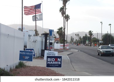 Phoenix, Ariz. / USA - October 26, 2020: Flags Fly Above Election Signs For Candidates, Including Mark Kelly For Arizona Senate And For President, Joe Biden With Running Mate Kamala Harris. 1442