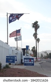 Phoenix, Ariz. / USA - October 26, 2020: Flags Fly Above Election Signs For Candidates, Including Mark Kelly For Arizona Senate And For President, Joe Biden With Running Mate Kamala Harris. 1448