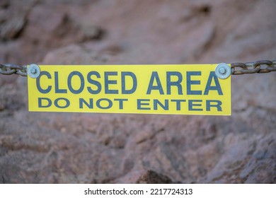 Phoenix, Arizona- Close-up of a yellow signage with Closed Area Do Not Enter at Camelback Mountain. Hanging yelow signage against the rock mountain wall background. - Shutterstock ID 2217724313