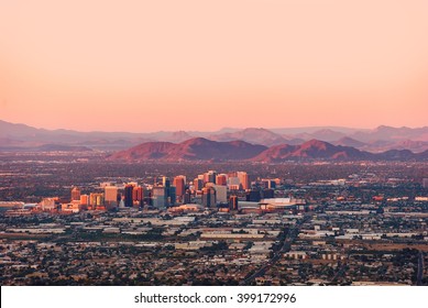 Phoenix Arizona with its downtown lit by the last rays of sun at the dusk. - Shutterstock ID 399172996