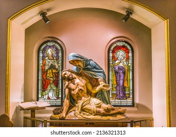 PHOENIX, ARIZONA  - MAY 24, 2021 Pieta Virgin Mary Dead Jesus Crucifixion Stained Glass Saint Mary Basilica Church Immaculate Conception Blessed Mary Phoenix Arizona stained glass from 1915 