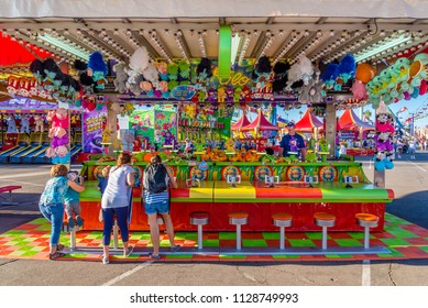 Phoenix, Arizona - October 25, 2017: Kids Play A Water Gun Game At The Arizona State Fair In Phoenix.