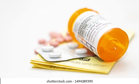 Phoenix, Arizona/USA - September 2, 2019: Prescription Bottle Of Malaria Prevention Medicine Atovaquone -Proguanil And A Pack Of Azithromycin Antibiotic Tablets With A CDC Immunization Certificate 