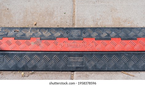 Phoenix, AZ - March 20, 2021: Guard Dog Low Profile ADA Cable Protector By Checkers Safety Products On A Sidewalk. Checkers Is One Of Justrite Safety Group's Family Of Industrial Safety Companies.