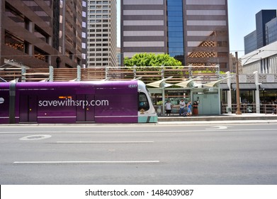 PHOENIX, AZ / USA - July 6 2011: Northbound Valley Metro Rail Train Approaches The Washington/Central Ave Light Rail Station In Downtown Phoenix.