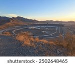 Phoenix Raceway wide view seen from a hiking trail during Sunset.