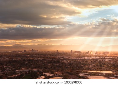 Phoenix,Az,USA; Aerial View Of The Downtown Area, Sun Rays Peaking Through Clouds.