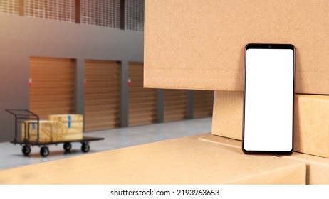 Phone Application. Smartphone Mockup On Boxes. Warehouse Mock Up. Mobile Phone With Blank White Screen. Website Gadget Template. Place For App Warehouse. Business Warehouse. Art Blurred. 