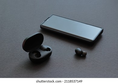 A Phone With Bluetooth Headphones