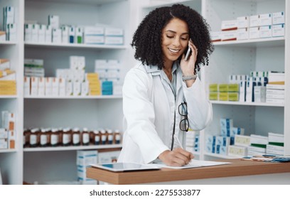 Phone call, counter and pharmacist woman for medicine note, customer service or virtual healthcare support. Happy, friendly doctor, medical retail person in pharmacy talking on cellphone at help desk - Powered by Shutterstock