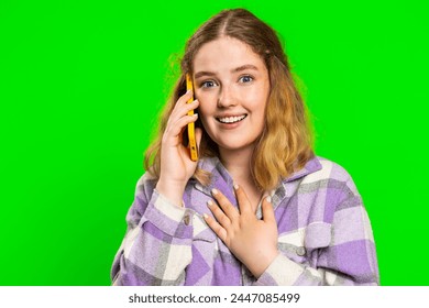 Phone call, good news, gossip. Happy surprised young caucasian woman involved in pleasant conversation on smartphone, enjoying talking with friend. Redhead girl isolated on green chroma key background - Powered by Shutterstock