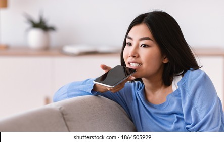 Phone Call, Mobile Communication And Voice Assistant Concept. Asian Woman Using Cellphone Audio Recognition To Send Message, Holding Gadget Near Mouth. Lady Talking On Mobile Loudspeaker