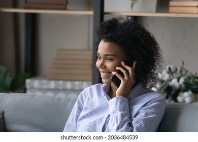 Phone call. Smiling black millennial female agent manager realtor talk on cell counsel advice customer on distance. Happy young afro american lady hold smartphone at ear listen to caller. Copy space