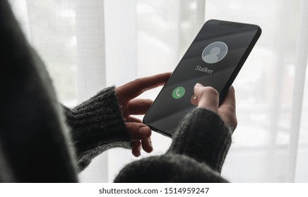 Phone Call From A Stalker At Home. Stalking Or Bullying With Smartphone Concept. Stalker Caller, Scammer Or Stranger. Woman Answering To Incoming Call. Ex Boyfriend With Fake Identity.