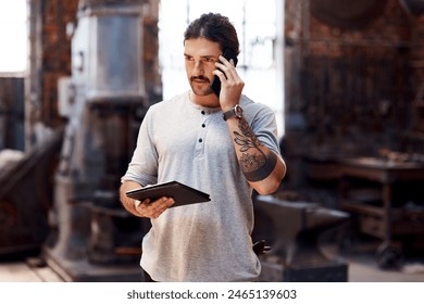 Phone call, tablet and thinking with man in workshop for communication, manufacturing or production. Craftsmanship, forge and online order with blacksmith talking on mobile for industrial metalwork - Powered by Shutterstock