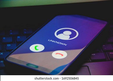 Phone Call From Unknown Number Late At Night. Scam, Fraud Or Phishing With Smartphone Concept.