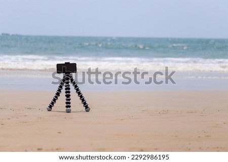 phone camera kept on a tripod and left at the beach for time lapse