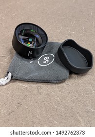 Phone Camera Lense Attachment, Lens Cap, And Microfiber Pouch.