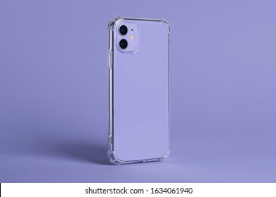 Phone Case Mock Up Side View. Purple 12 IPhone 11 In Clear Silicone Case Isolated On Purple Background, Rotated Position. Smartphone Perspective View Very Peri 2022 Color