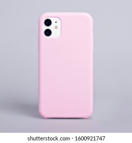 Phone Case Mockup. IPhone 11 Smartphone Back View In Pink Cover Isolated On Gray Background