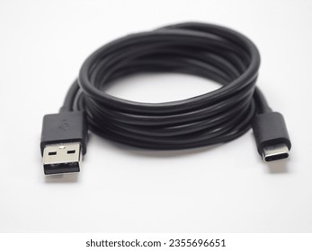 Phone charger cable.
Black usb type c charging cable on white background.