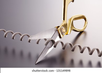 Phone Cord Being Cut By Scissors